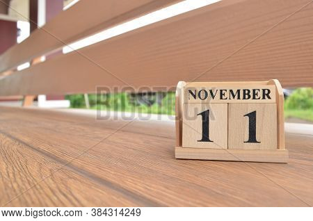 November 11, Number Cube With Wooden Balcony Background.