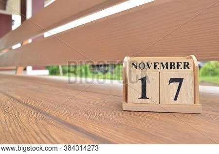 November 17, Number Cube With Wooden Balcony Background.