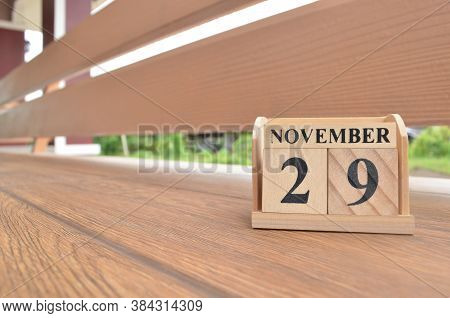 November 29, Number Cube With Wooden Balcony Background.