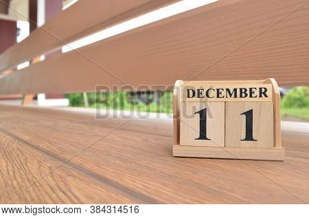 December 11, Number Cube With Wooden Balcony Background.