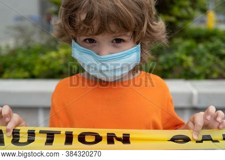 Kid Use Medical Mask Or Surgical Mask To Protect Her From Virus, Sickness, Covit-19 And Coronavirus 
