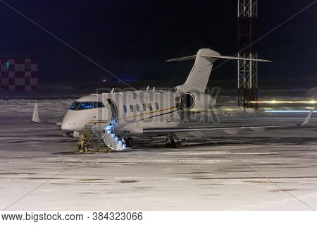 Private Jet Plane At Night Airport Apron