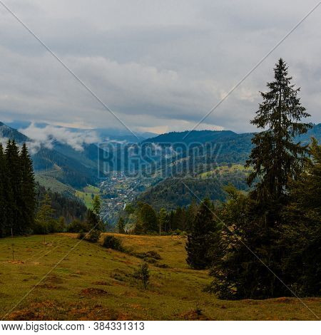 Ukrainian Picturesque Carpathian Village Luhy, Located At The Foot Of Many Mountains And Near The Ri