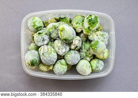 Frozen Brussels Sprouts In A Plastic Container For Long-term Storage. Deep Freezing Of Vegetables. F