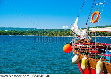 Waterfront And Old Ships In The Harbor In Town Of Punat On The Island Of Krk, Adriatic Coast, Croati