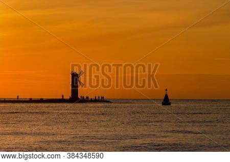Navigation Sign On The Breakwater - Sunset On The Seashore In Swinoujscie