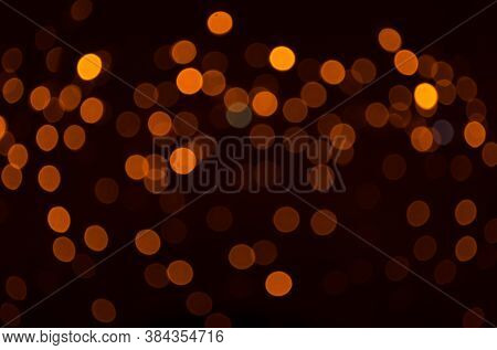Plenty Of Golden Sparkling Bokeh From Defocused Garland Lights. Backdrop For Design. Bright Christma