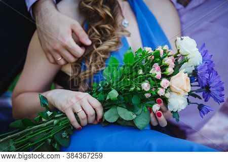 Just Married Couple Hands.bouquet Of Lower Roses