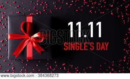 Online Shopping Of China, 11.11 Singles Day Sale Concept. Top View Of Black Christmas Boxes With Red