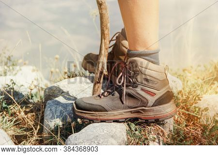 Close Up Of Women Legs Wearing Hiking Boots Stainding In Mountain - Travel And Outdoor Activities Co