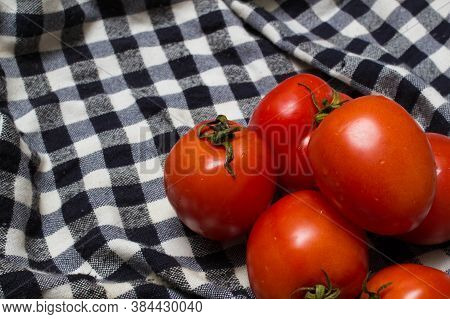Juicy Red Tomatoes In Table Cloth . Caro Background