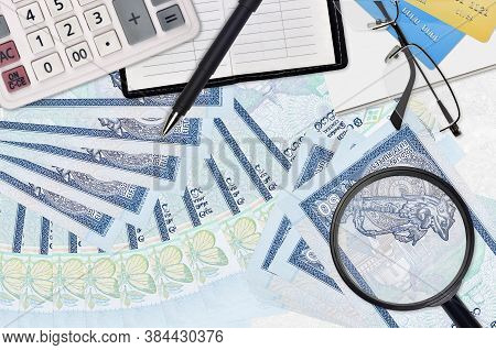 50 Sri Lankan Rupees Bills And Calculator With Glasses And Pen. Tax Payment Season Concept Or Invest
