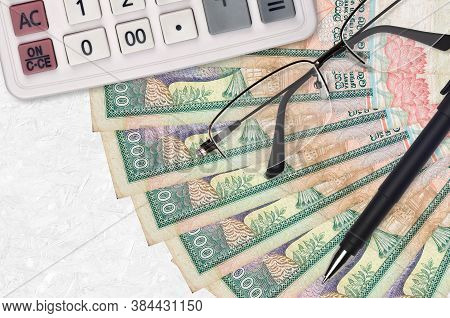1000 Sri Lankan Rupees Bills Fan And Calculator With Glasses And Pen. Business Loan Or Tax Payment S