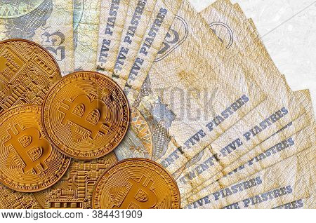 25 Egyptian Piastres Bills And Golden Bitcoins. Cryptocurrency Investment Concept. Crypto Mining Or 