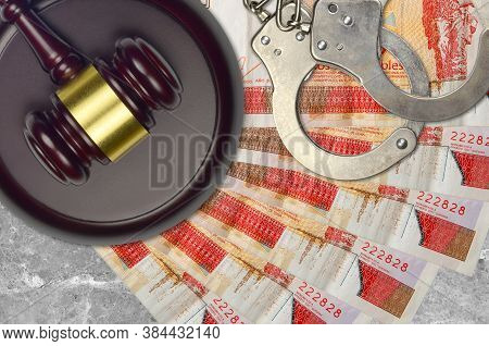 3 Cuban Pesos Convertibles Bills And Judge Hammer With Police Handcuffs On Court Desk. Concept Of Ju