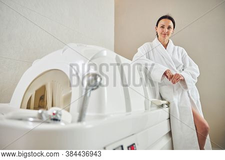 Confident Lady Satisfied With Good Treatment In Beauty Center