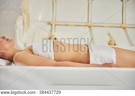 Multifunctional Spa Capsule And Young Woman Using It