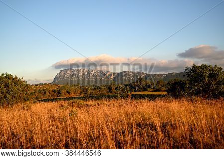 Pic Saint Loup Mountain With A Big Cloud At The End Of The Day