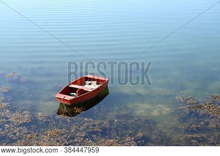 Small Dinghy In A Bay. Guilvinec, French Brittany