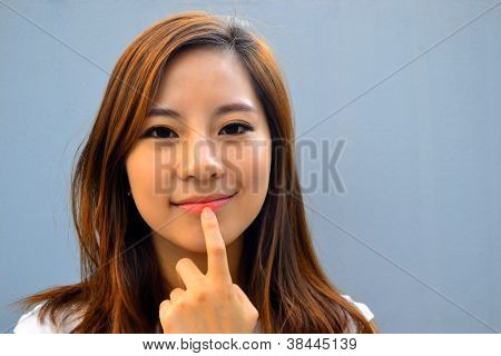 Beautiful young asian woman thinking