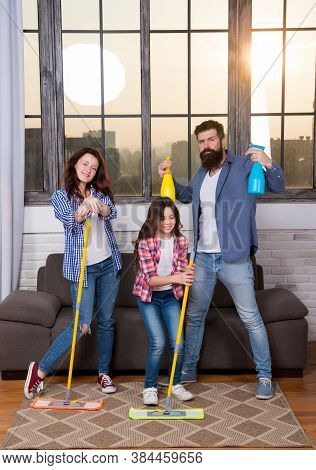 Kill All Germs. Mother Father And Little Girl Child Cleaning Home With Sanitizer.