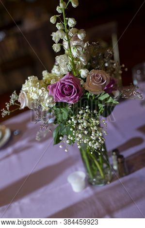 A Bouguet Of Flower On The Table