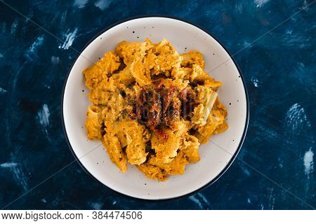 Healthy Plant-based Food Recipes Concept, Vegan Maccheroni Pasta With Hummus Based Sauce And Sundrie