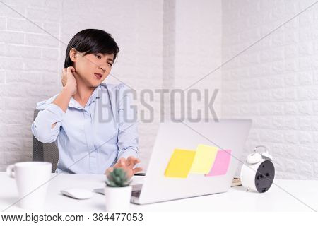Woman Scratching Her Skin At Office