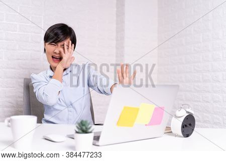 Woman Sitting At Home Office Working Using Computer Laptop And Shocking And Scared Something