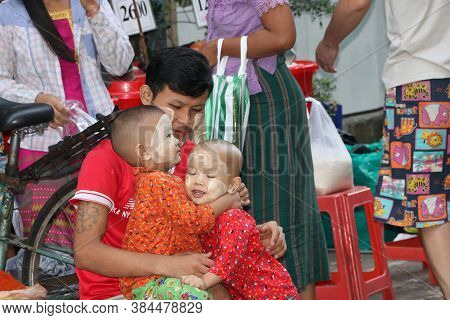 Yangon, Myanmar, Feb 24, 2019: Myanmese Father And 2 Children With Thanakha (myanmar Powder) On Thei