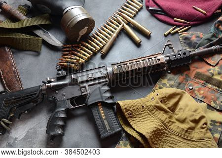 Assault Rifle (m4a1)  With Ammunition On Camouflage Uniform,and Military Equipment For Army,bullets 