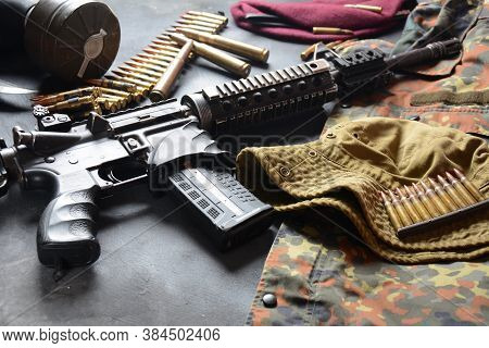 Assault Rifle (m4a1)  With Ammunition On Camouflage Uniform,and Military Equipment For Army,bullets 