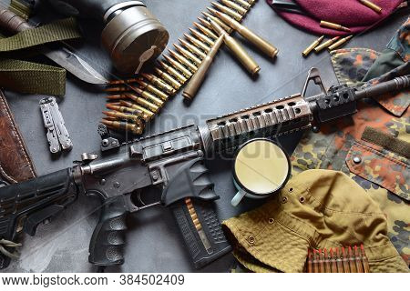 Assault Rifle (m4a1)  With Ammunition On Camouflage Uniform,and Military Equipment For Army,bullets 