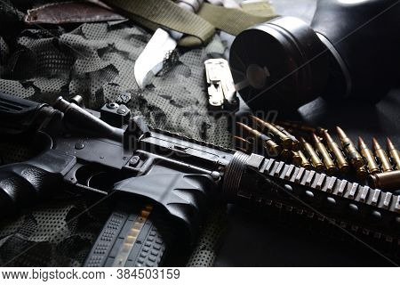 Assault Rifle (m4a1)  With Ammunition On Camouflage Uniform,and Military Equipment For Army,bullets 