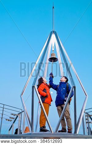 Sapporo, Hokkaido, Japan - December 2019 : A Love Couple Ringing The Bell At Top Of Mt. Moiwa In Sap