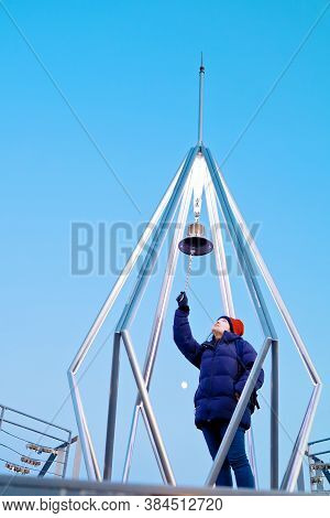 Sapporo, Hokkaido, Japan - December 2019 : A Woman Ringing The Bell At Top Of Mt. Moiwa In Sapporo C