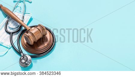 Judge Gavel With Medical Mask And Stethoscope On Blue Backgroun Protection Of Medical Rights Concept