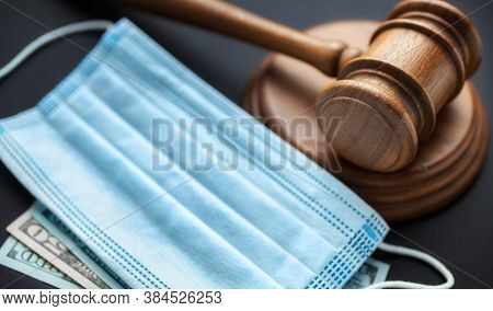 Judge Gavel With Medical Mask And Money On Dark Background Corruption In The Medical Field Concept