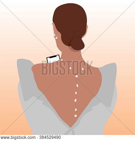Brunette Girl With Smartphone In A White Dress Standing With Her Back With A Pearl Decoration Around