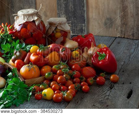 Tomatoes, Peppers, Onions On The Table. Preservation Of The Autumn Harvest Of Vegetables. Glass Jar 