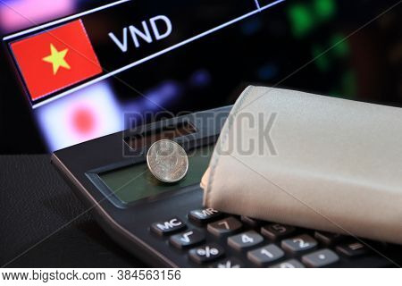 Two Hundred Vietnam Dong Coin On Obverse (vnd) On Black Calculator And Wallet With Digital Board Of 