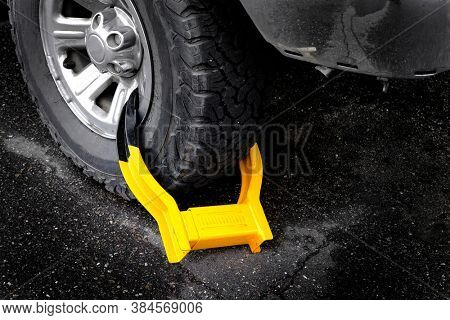 Wheet boot or tire lock on a vehicle or car for illegal parking violation 