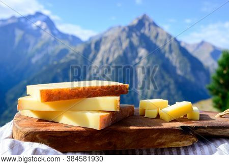 Cheese Collection, French Comte, Beaufort Or Abondance Cow Milk Cheese Served Outdoor With Alps Moun