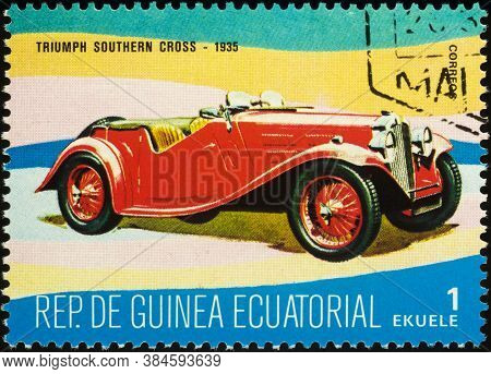Moscow, Russia - September 09, 2020: Stamp Printed In Equatorial Guinea Shows British Retro Car Triu