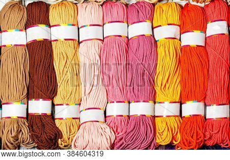 Skeins Of Polyester Cord In Various Bright Colors Of Hot Shades, Rolled Into Rolls, Close-up, Copy S