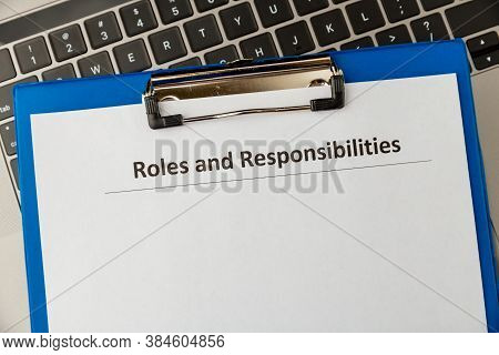 Roles And Responcibilities Document In The Tablet At The Desk.