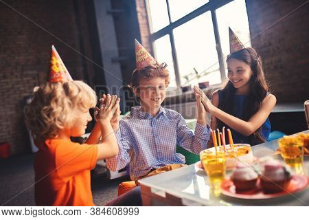Three Kids Celebrating Bday And Feeling Happy