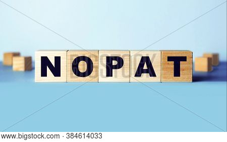 Net Operating Profit After Tax (nopat) Is An Abbreviation Made Of Wooden Cubes. Finance Concept.