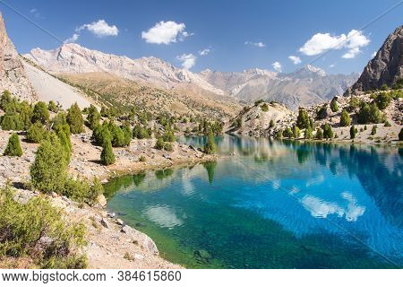 Tajikistan. Mountain Landscape. Rocky Path. Sunny Day In Alaudin Lake.