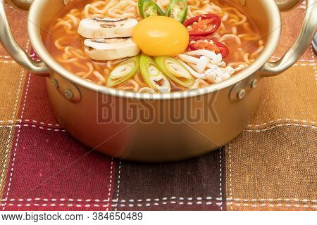 Serving A Korean Style Instant Noodle, Ramyeon With Egg Yolk, Chilli In A Traditional Korean Noodle 